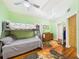 Large bedroom with bunk bed, hardwood floors, and ensuite bathroom access at 2418 W 1St St, Sanford, FL 32771