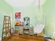 Fun bedroom with loft bed, hammock, and stained glass windows at 2418 W 1St St, Sanford, FL 32771