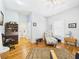 Bedroom with hardwood floors, desk, and decorative chaise lounge at 2418 W 1St St, Sanford, FL 32771