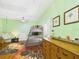 Cozy bedroom features a bunk bed, dresser, hammock, and colorful rugs at 2418 W 1St St, Sanford, FL 32771