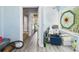 Bright hallway with storage areas featuring a stained glass accent window at 2418 W 1St St, Sanford, FL 32771