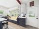 Cozy kitchen with custom cabinets, window seating, stainless steel appliances, and bright natural light at 2418 W 1St St, Sanford, FL 32771