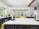 Charming kitchen with large island, granite counters, and seating at the island at 2418 W 1St St, Sanford, FL 32771
