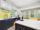 Bright eat-in kitchen with views from the sink and island seating area at 2418 W 1St St, Sanford, FL 32771