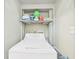 Washer and dryer with laundry products on a shelf at 2418 W 1St St, Sanford, FL 32771