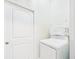 Functional laundry area featuring stacked washer and dryer for space-saving convenience at 2418 W 1St St, Sanford, FL 32771