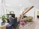 Inviting living room with staircase, fireplace, and cozy seating area bathed in natural light at 2418 W 1St St, Sanford, FL 32771