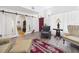 Elegant living room featuring sliding glass doors, wood floors, and stylish decor at 2418 W 1St St, Sanford, FL 32771