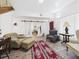 Bright living room with hardwood floors, area rug, and comfortable seating at 2418 W 1St St, Sanford, FL 32771
