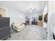 Bright main bedroom features a ceiling fan, carpet, and a convenient walk-in closet for storage at 2418 W 1St St, Sanford, FL 32771