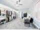 Spacious main bedroom with a ceiling fan and large open closet spaces at 2418 W 1St St, Sanford, FL 32771
