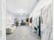 Spacious main bedroom with walk-in closet, light blue walls, ceiling fan, and sitting area at 2418 W 1St St, Sanford, FL 32771
