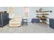 Comfortable main bedroom with cozy seating area, dresser, and natural light, perfect for relaxing at 2418 W 1St St, Sanford, FL 32771