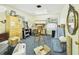 Bright office space, offers storage cabinets, ladder, and natural light, creating a functional and inviting workspace at 2418 W 1St St, Sanford, FL 32771
