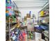 Organized pantry featuring metal shelving, an utility sink, and ample storage for food and supplies at 2418 W 1St St, Sanford, FL 32771