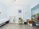 Bright room with a unique stained glass window adding an artistic touch at 2418 W 1St St, Sanford, FL 32771