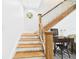 Staircase featuring hardwood steps and banister, with a decorative window on the wall at 2418 W 1St St, Sanford, FL 32771