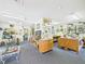 Bright studio space with gray carpet, featuring multiple work stations and ample room for projects and hobbies at 2418 W 1St St, Sanford, FL 32771