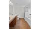 This bright bathroom has a shower, tub, vanity with storage, and tile floors at 2505 Brownwood Dr, Mulberry, FL 33860