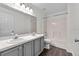 Bathroom featuring a double vanity and a shower-tub combo at 2505 Brownwood Dr, Mulberry, FL 33860