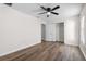 This bedroom has wood-look floors, and double-door closet at 2505 Brownwood Dr, Mulberry, FL 33860