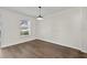 Bedroom with dark laminate flooring and one window at 2505 Brownwood Dr, Mulberry, FL 33860