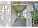 Covered front porch with a decorative glass front door at 2505 Brownwood Dr, Mulberry, FL 33860