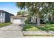 Charming single-story home with a well-maintained lawn and an attached two-car garage at 2505 Brownwood Dr, Mulberry, FL 33860