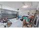 Spacious garage with visible garage door mechanics and overhead lighting at 2505 Brownwood Dr, Mulberry, FL 33860