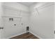 Walk in laundry room with wire shelving, white walls, and wood-look flooring at 2505 Brownwood Dr, Mulberry, FL 33860