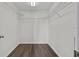 A walk-in closet featuring dark wood-look floors and wire shelving at 2505 Brownwood Dr, Mulberry, FL 33860
