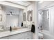 The bathroom is updated with granite countertops and tiled shower at 4125 Sunny View Dr, Lakeland, FL 33813