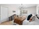 The light-filled bedroom has updated flooring and an updated light fixture at 4125 Sunny View Dr, Lakeland, FL 33813