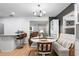 Dining area features a modern chandelier and a cozy banquette seating at 4125 Sunny View Dr, Lakeland, FL 33813