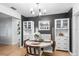 Dining area features a modern chandelier and built-in shelving for storage at 4125 Sunny View Dr, Lakeland, FL 33813