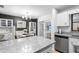 Eat-in kitchen features granite counters, modern appliances and access to the lanai at 4125 Sunny View Dr, Lakeland, FL 33813