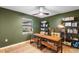 This home office has dark green paint, bookshelves, and a large desk at 4125 Sunny View Dr, Lakeland, FL 33813
