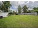 Spacious backyard features a well-maintained lawn and perimeter fencing at 4921 Sharon Ave, Lakeland, FL 33812