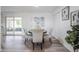 Bright dining area with sliding doors, comfortable seating for four, and ample natural light at 4921 Sharon Ave, Lakeland, FL 33812