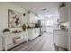Well-lit kitchen featuring white cabinets, stainless steel appliances, and modern countertops at 4921 Sharon Ave, Lakeland, FL 33812