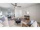 Tastefully decorated living room, transitioning into dining room with a modern round mirror on the wall at 4921 Sharon Ave, Lakeland, FL 33812