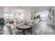 Open-concept living space with modern decor, including dining area, living room, and kitchen at 4921 Sharon Ave, Lakeland, FL 33812