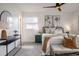 Well-lit main bedroom with a large bed, stylish furnishings, and carpet flooring at 4921 Sharon Ave, Lakeland, FL 33812