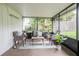 Comfortable screened-in patio with seating, plants, and a relaxing outdoor ambiance at 4921 Sharon Ave, Lakeland, FL 33812