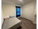 Simple bedroom featuring a window, closet, and gray sheets at 516 Ingleside Ln, Haines City, FL 33844