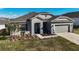 Lovely single story home with two car garage, manicured lawn, and tasteful landscaping at 516 Ingleside Ln, Haines City, FL 33844
