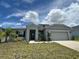 Beautiful single story home with a two car garage and meticulous landscaping at 516 Ingleside Ln, Haines City, FL 33844