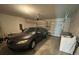 Spacious two car garage with new appliances and a modern car at 516 Ingleside Ln, Haines City, FL 33844
