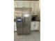 Stainless steel refrigerator with water and ice dispenser with white cabinetry at 516 Ingleside Ln, Haines City, FL 33844