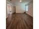 Expansive living room with hardwood floors, natural light, and open layout at 516 Ingleside Ln, Haines City, FL 33844